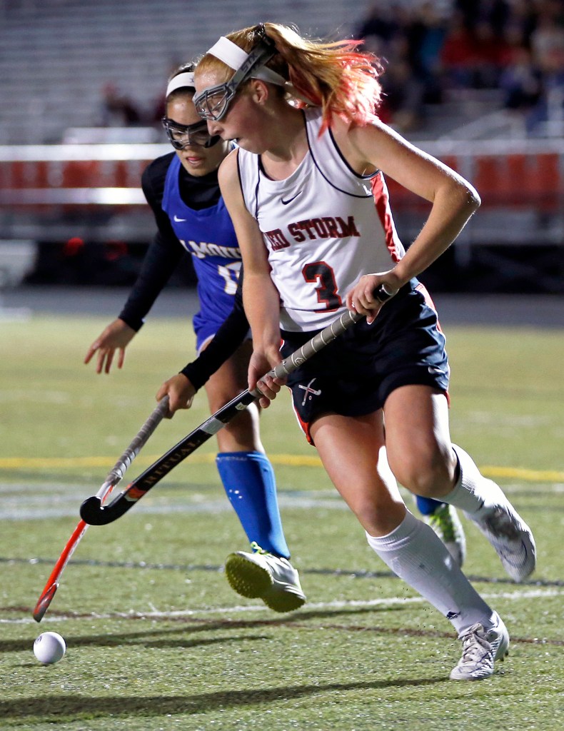 Scarborough forward Carrie Timpson and Falmouth defender Juliana LaPorta vie for possession Tuesday at Scarborough.