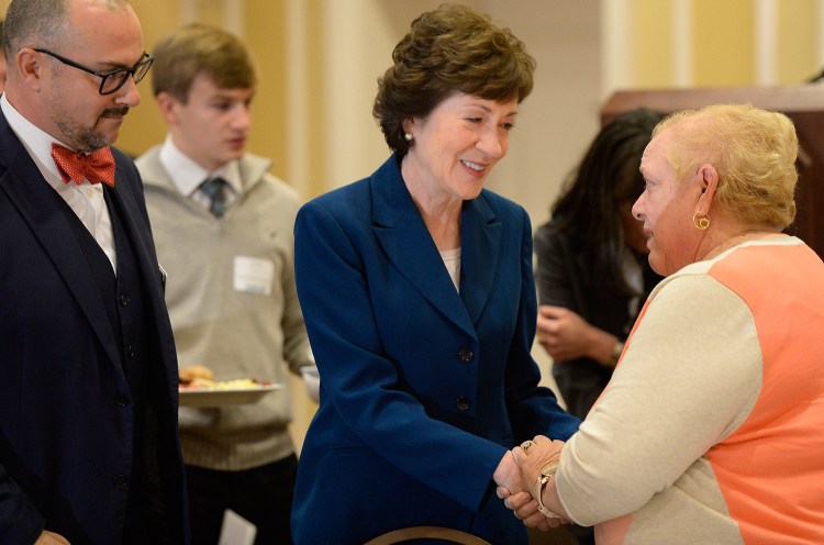 Sen. Susan Collins speaks with people at Friday's Penobscot Bay Regional Chamber of Commerce event.