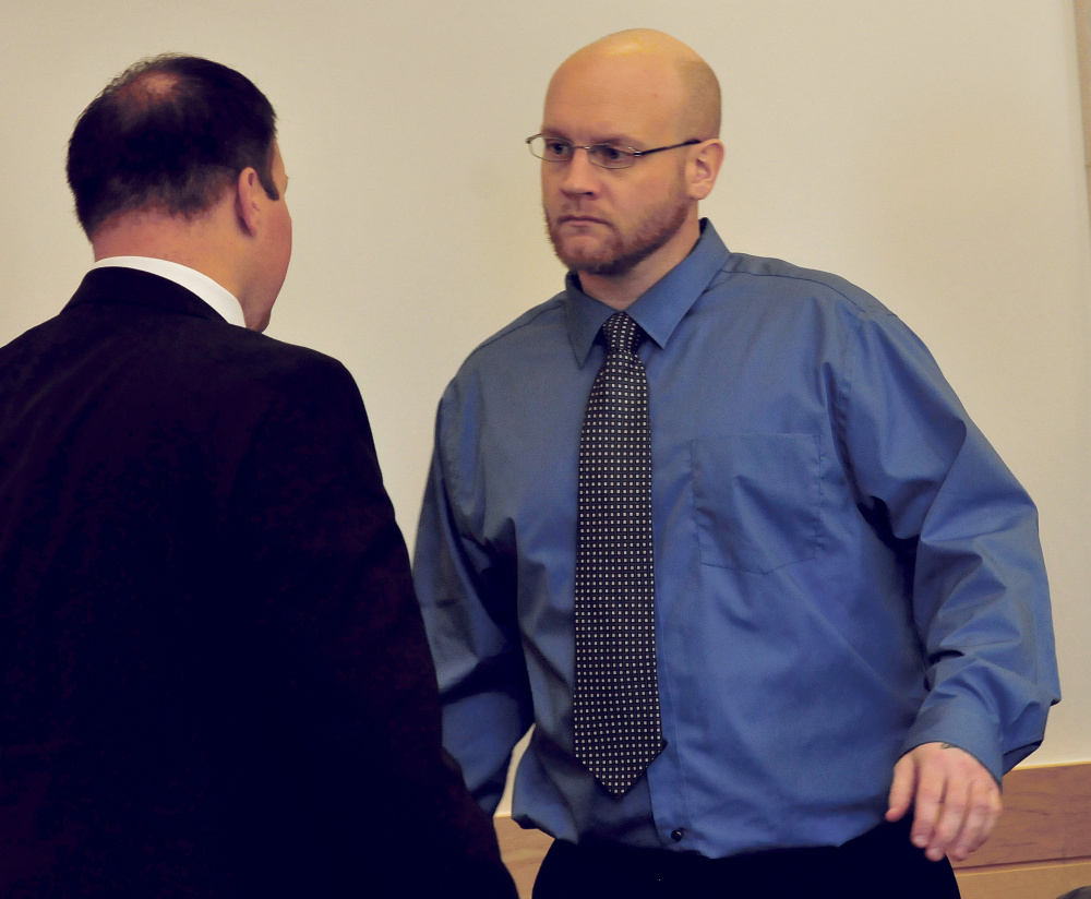 Murder defendant Robert Burton, right, confers with attorney Zachary Brandmeir before closing arguments Wednesday at the Penobscot Judicial Center in Bangor.
