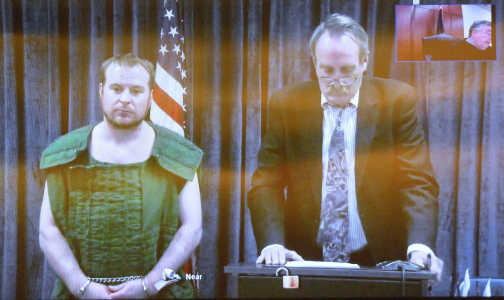 Jeremy Clement, left, and his attorney Steve Bourget appear on video from the Kennebec County jail during his initial appearance on April 21 at Capital Judicial Center in Augusta.