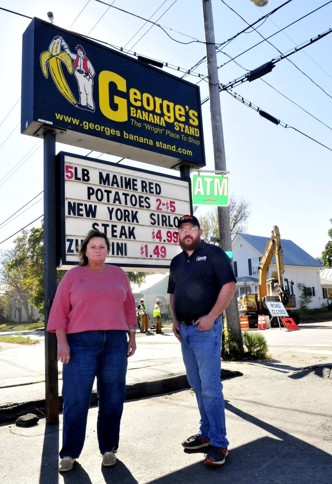George's Banana Stand store manager Darlene Holt and meat manager Brent Wright, interviewed Wednesday, lament the loss of business that sewer line construction on North Avenue in Skowhegan has caused since it began in July. Originally planned to be completed in November, the project is behind schedule, is expected to stall when winter closes in, and will resume in the spring.