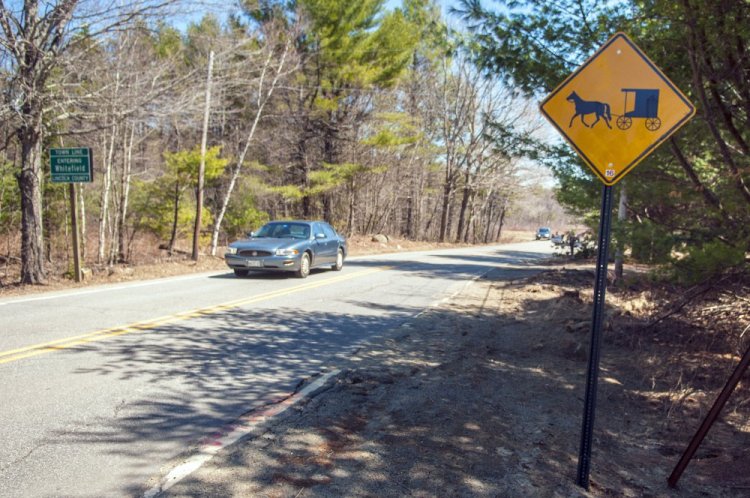 This horse-and-buggy sign, shown in April at Whitefield's municipal boundary with Pittston on Route 194, was one of the early efforts to warn motorists about the slowly moving vehicles.