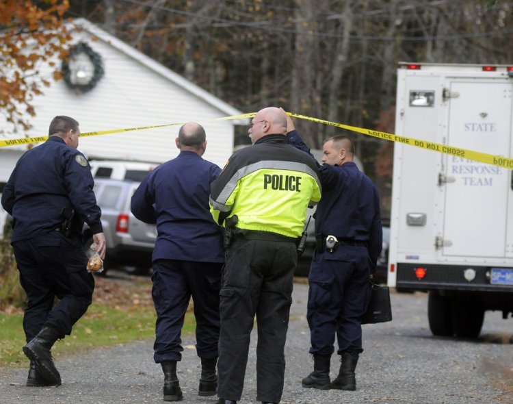 State police detectives enter the driveway of the home in Winthrop where the bodies of Antonio and Alice Balcer were discovered early in the morning on Oct. 31, 2016.