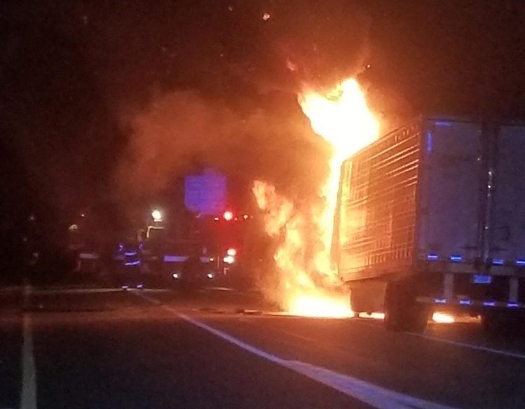 A tractor-trailer hauling frozen food burst into flames Monday night on the Maine Turnpike in West Gardiner.