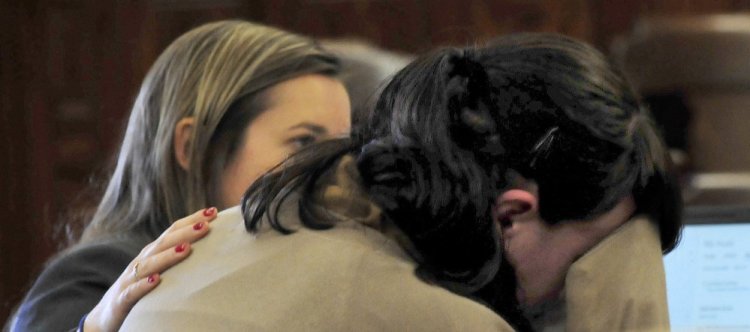 Defendant Miranda Hopkins, of Troy, right, breaks down crying Tuesday while listening to an audiotape of the 911 call to police during her trial in connection with the death of her infant son, Jaxson. Her attorney, Laura Shaw, comforts Hopkins.