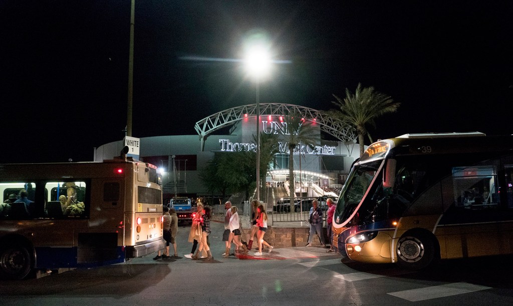 People load into buses destined to different Strip Casinos following a mass shooting Sunday.
