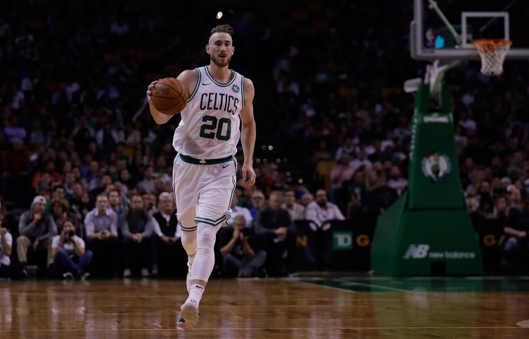 Boston Celtics forward Gordon Hayward brings the ball up court during the first quarter of an NBA preseason basketball game in Boston Monday.