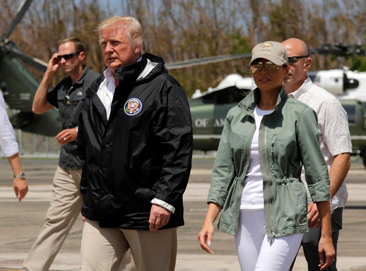 President Trump and first lady Melania Trump arrive at the Luis Muñiz Air National Guard Base in San Juan, Puerto Rico.