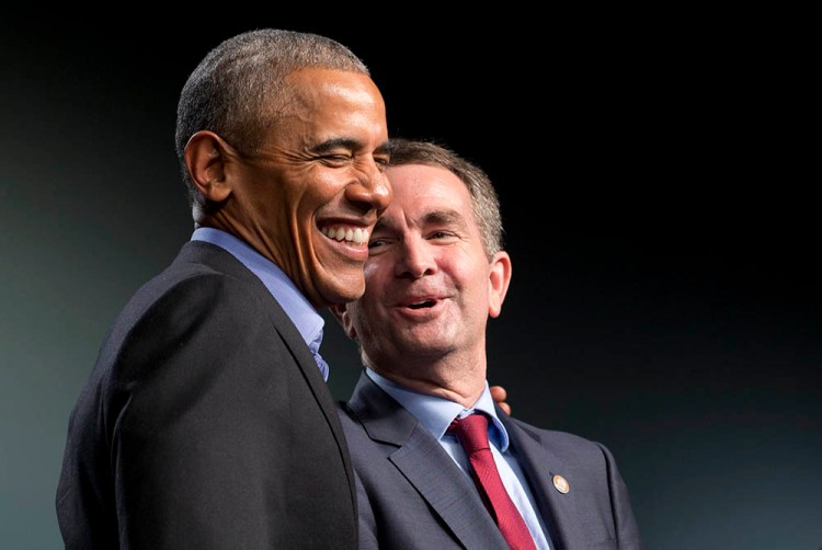 Former President Barack Obama laughs with Virginia's Democratic gubernatorial candidate Lt. Gov. Ralph Northam during a rally in Richmond, Va., Thursday.