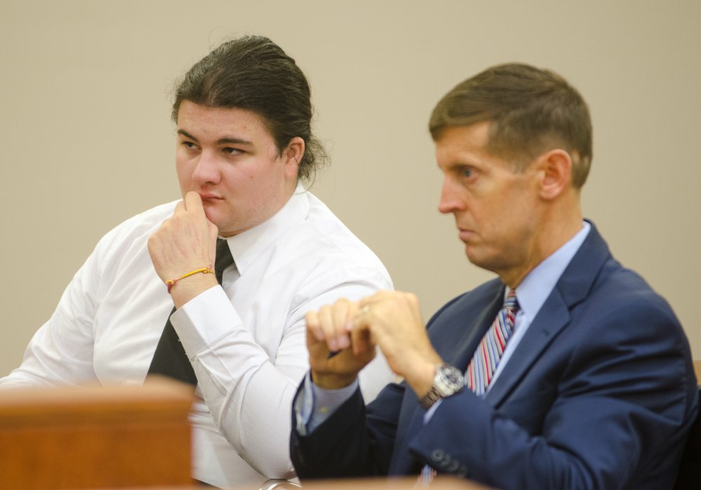 Andrew Balcer, 18, left, sits with his attorney, Walter McKee, during a hearing Thursday at Capital Judicial Center in Augusta, where a judge will determine whether he should face trial as an adult on double murder charges.