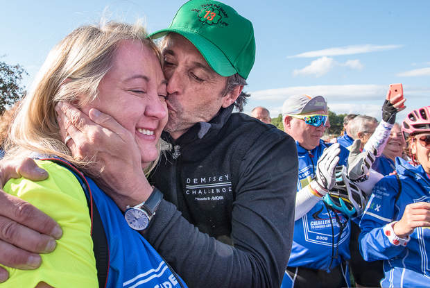 Shannon Howard of Greenville, S.C., gets a kiss from Patrick Dempsey in Veterans Memorial Park in Lewiston on Friday.