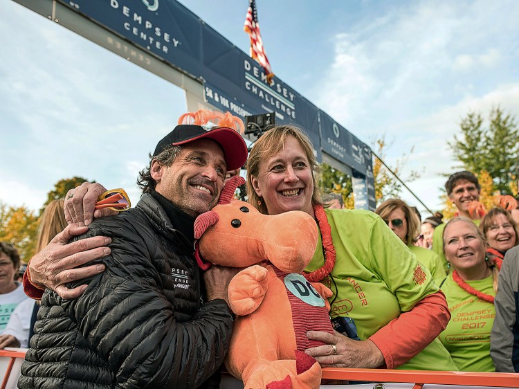 Actor Patrick Dempsey poses with Nina Houghton at the starting line of the Dempsey Challenge, a cancer fundraiser, on Saturday in Lewiston. 