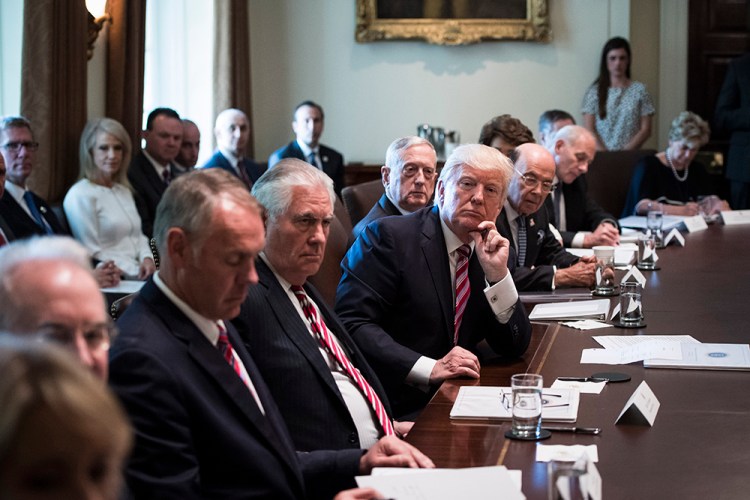 President Trump listens as officials heap praise on him at a Cabinet meeting June 12. From left, Secretary of State Rex Tillerson, Defense Secretary Jim Mattis and Commerce Secretary Wilbur Ross. 