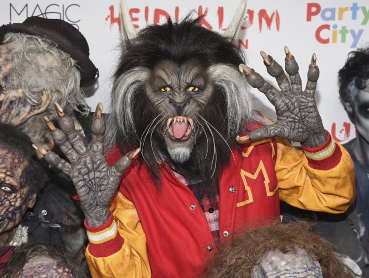 Heidi Klum, dressed as a werewolf from Michael Jackson's "Thriller" video, attends her Halloween party at Moxy Times Square in New York.
Evan Agostini/Invision/AP
