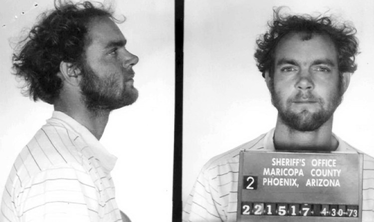 This 1973 booking photo from Arizona shows Terry Peder Rasmussen. Authorities want to learn about a woman he was seen with in the 1970s, saying she may be the mother of one of the young girls whose bodies were found in barrels near a New Hampshire state park in 1985 and 2000. Maricopa County Sheriff's Office/New Hampshire Office of the Attorney General via Associated Press