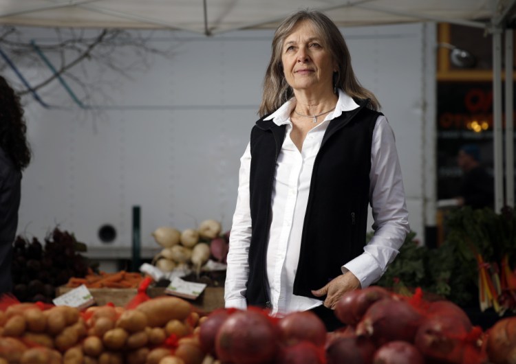 Katherine Paul of the Organic Consumers Association at the Portland Farmers Market in Monument Square on Wednesday.