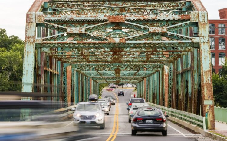 Continuing structural problems on the Brunswick-Topsham bridge, above, have led officials to lower the load limit to 25 tons. Maine earned a C- for its bridges and a D for its roads from a national civil engineering group.