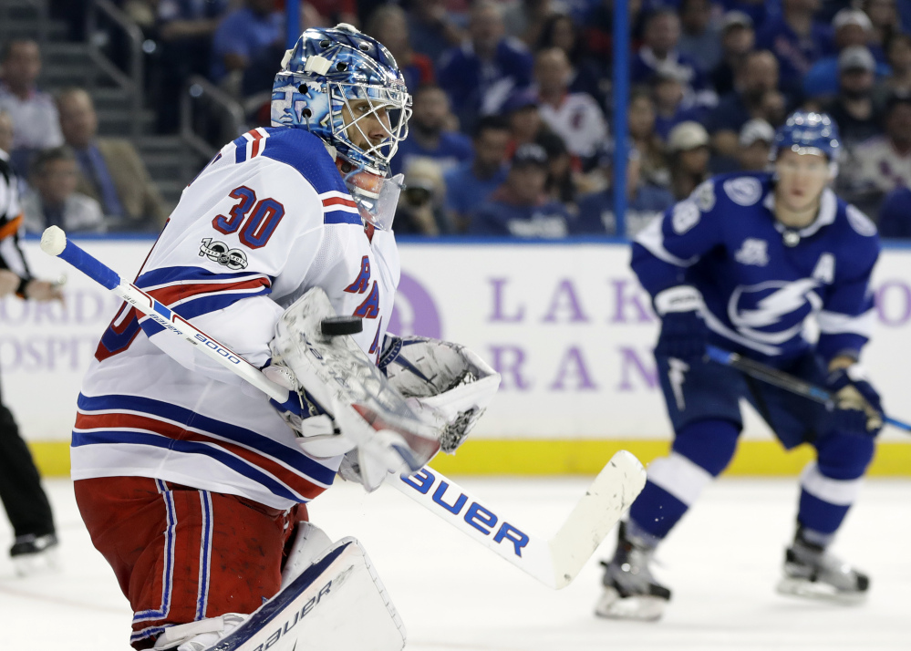 Rangers goalie Henrik Lundqvist makes a blocker save on a shot by the Tampa Bay Lightning in the second period Thursday night in Tampa, Fla.