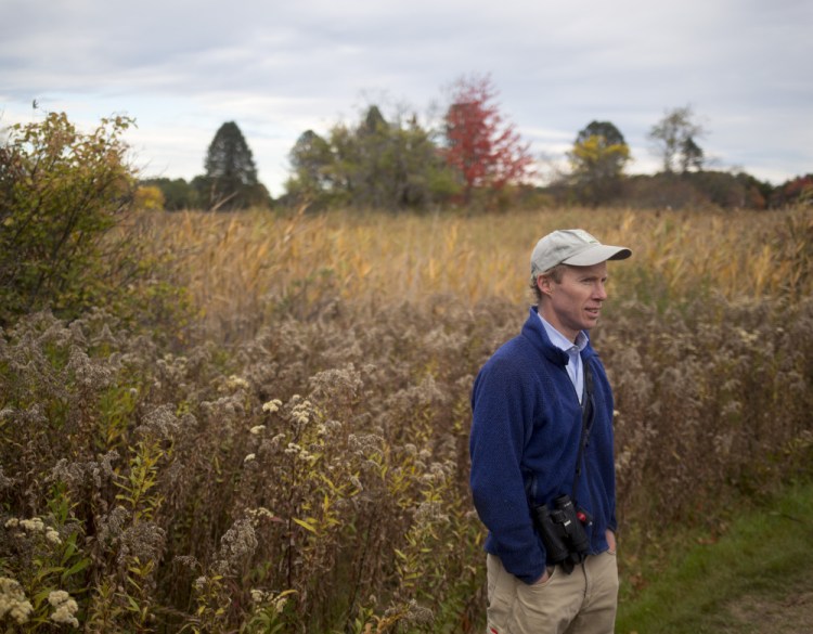 Angus King III, son and namesake of Maine's U.S. senator, walks the trails at Maine Audubon's Gilsland Farms in Falmouth. King said he has developed a love for hunting and birding, and feels his hunting experience makes him a more observant and aware bird watcher.