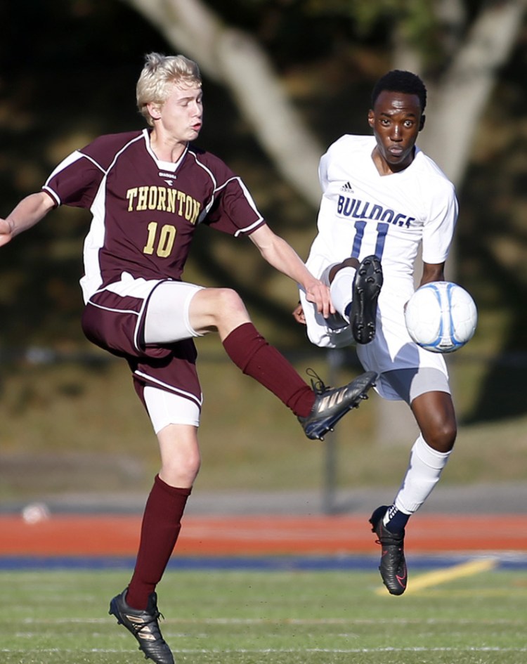 Samuel Nkurunziza of Portland, right, has come up with some clutch goals this season, one of them coming in the 2-1 win over Thornton Academy in the Class A South championship game.