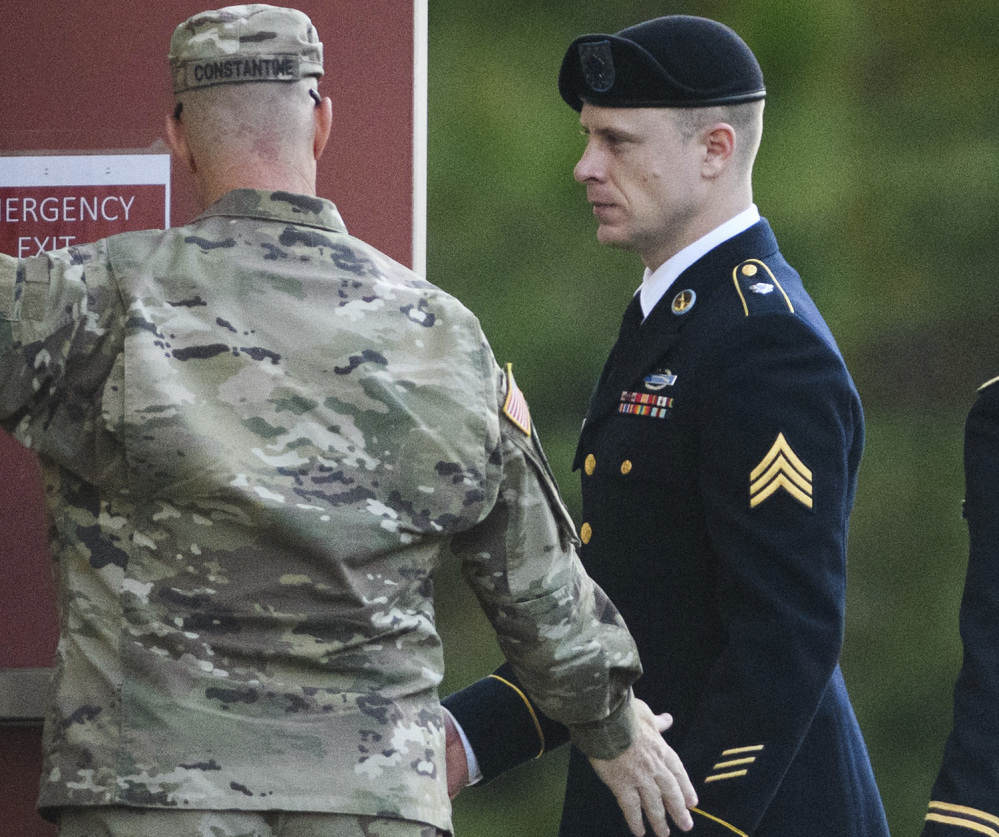 A tense Sgt. Bowe Bergdahl, right, arrives Friday at the Fort Bragg, N.C., courtroom facility after pleading guilty last month to desertion.