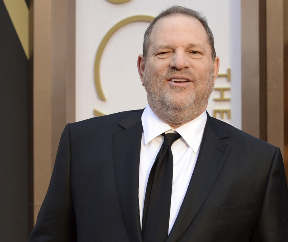 FILE - In this March 2, 2014 file photo, Harvey Weinstein arrives at the Oscars in Los Angeles. Day by day, the accusations pile up, as scores of women come forward to say they were victims of Weinstein. But others with stories to tell have not. For some of these women who've chosen not to go public, the fear of being associated forever with the sordid scandal _ and the effects on their careers, and their lives _ might be too great. Or they may still be struggling with the lingering effects of their encounters. (Photo by Jordan Strauss/Invision/AP, File)
