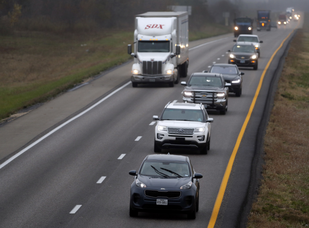 A driver holds up traffic in the passing lane along I-70 in Missouri. Many states are enacting laws against driving in the left lane except for passing or turning left.