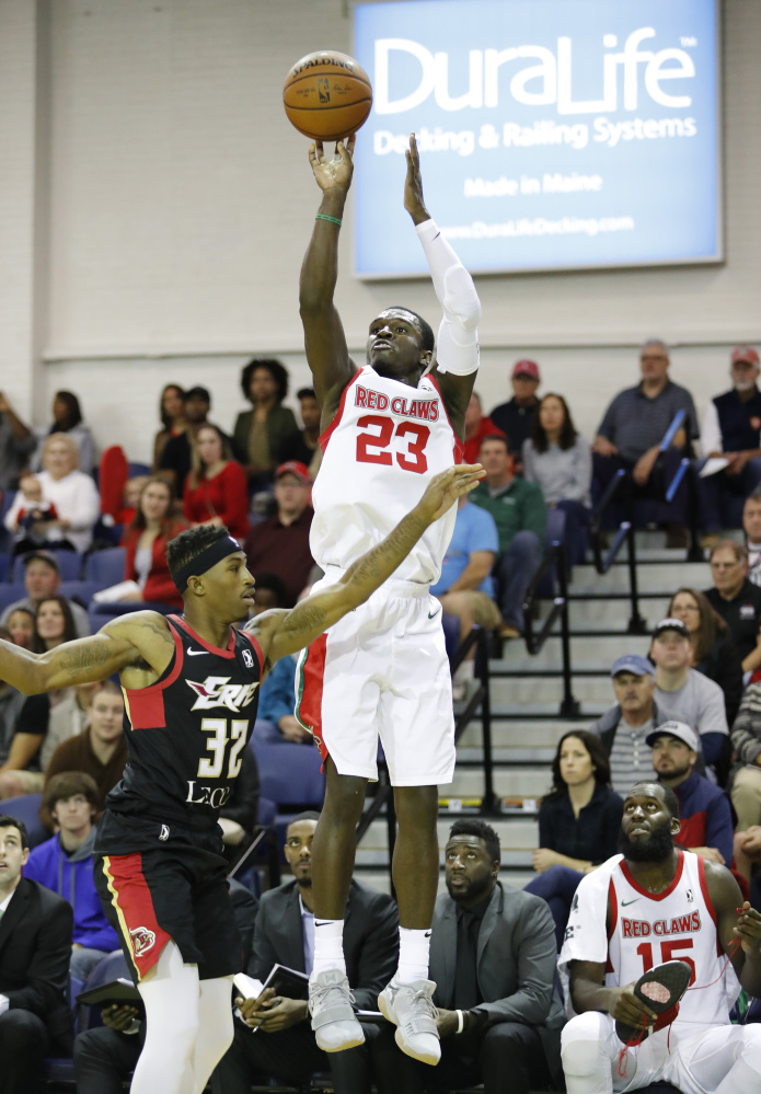 Maine's Jabari Bird shoots over Erie's Craig Sword during the first half of their game Sunday at the Portland Expo. Bird finished with 25 points and 10 rebounds in the Red Claws' 102-96 win.