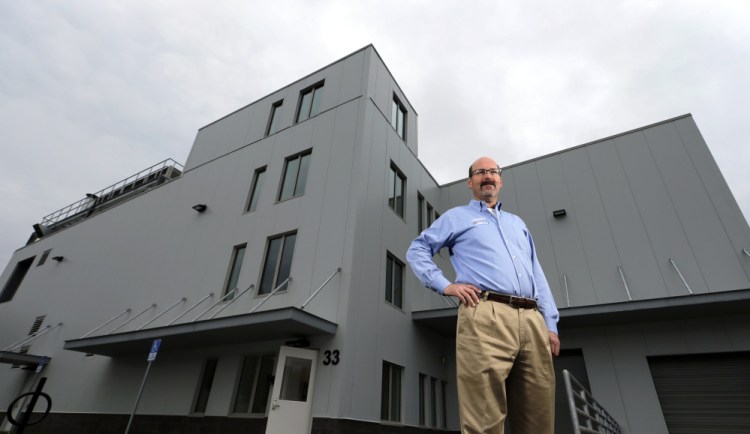 Michael Brigham, president and CEO of ImmuCell, stands outside the company's new building in the Riverside area of Portland. When fully complete, the facility will produce nisin – a natural antibiotic for dairy cattle.