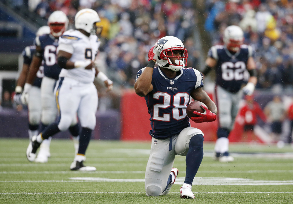 Running back James White, signaling a first down during the second half of New England's win over San Diego on Oct. 29, has been one of the Patriots' standouts in the first half of the season, despite somewhat limited opportunities.