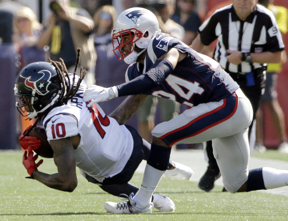 Texans wide receiver DeAndre Hopkins catches a pass in front of cornerback Stephon Gilmore on Sept. 24, a common sight in a disappointing Patriots debut season for Gilmore.