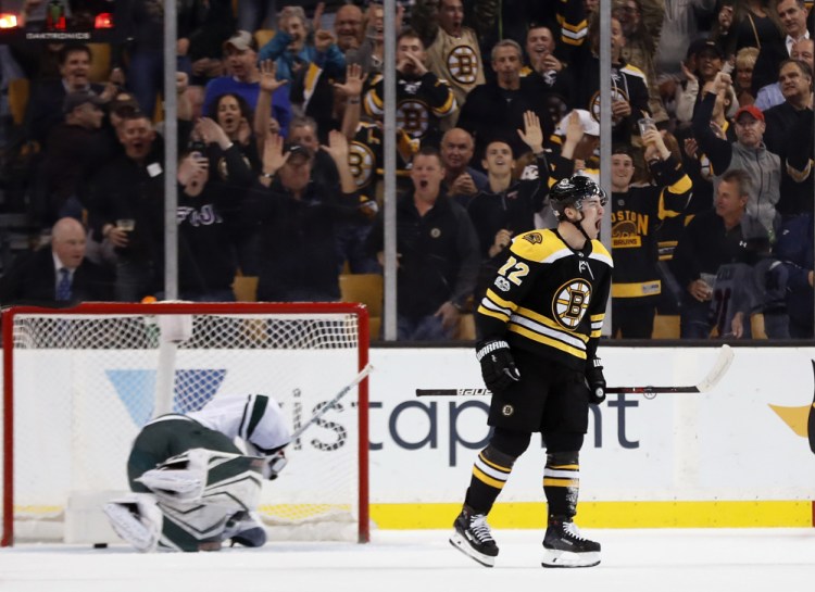 The Bruins' Frank Vatrano celebrates his goal on Minnesota Wild goalie Devan Dubnyk in the first period of Monday night's game in Boston. The goal gave Boston the lead for good.