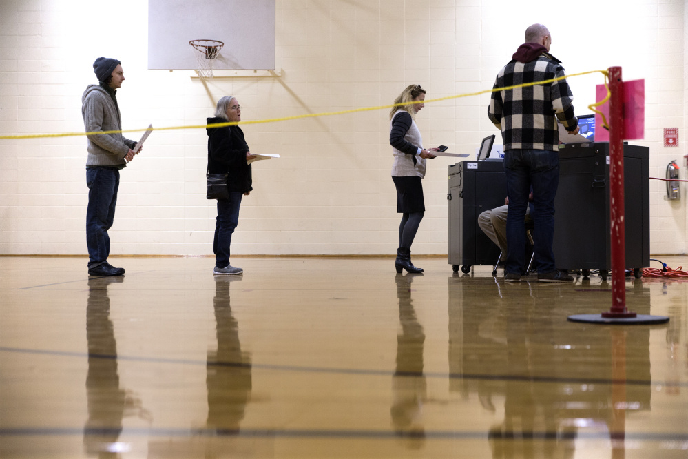 PORTLAND, ME - NOVEMBER 7: The line for the ballot machines at Reiche Elementary School dwindles after the morning rush. (Staff photo by Ben McCanna/Staff Photographer)