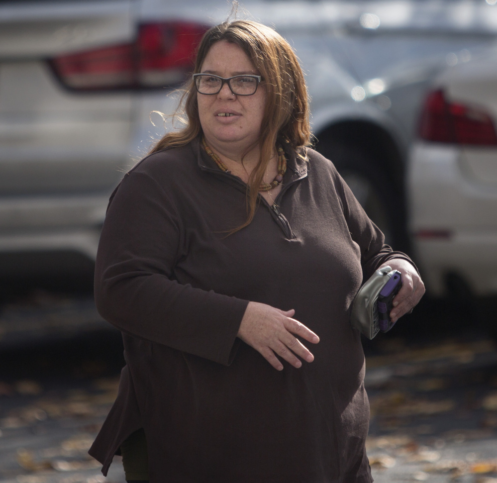 Hope Cady of Augusta walks to the Cumberland County Courthouse in Portland before taking the stand Tuesday in Anthony Sanborn's murder conviction review hearing.