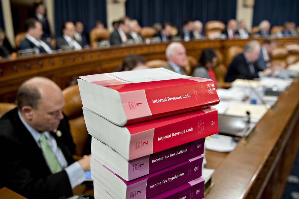 Tax code books sit on a table Monday as a House panel begins markup of the Republican tax bill.