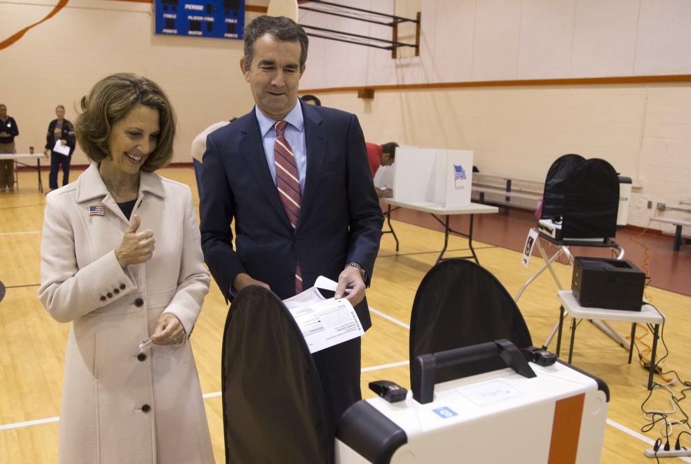 Gubernatorial candidate Lt. Gov. Ralph Northam and his wife, Pam, vote in Norfolk, Va., on Tuesday. Northam, a Democrat, defeated Republican Ed Gillespie.
