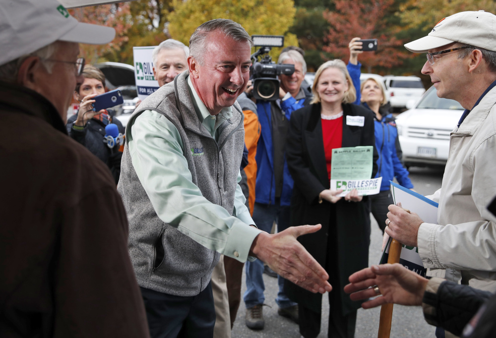 Republican candidate for Virginia governor Ed Gillespie shakes hands with supporters before voting at his polling place Tuesday in Alexandria, Va. Gillespie lost to Democrat Lt. Gov. Ralph Northam in Tuesday's election. (AP Photo/Alex Brandon)
