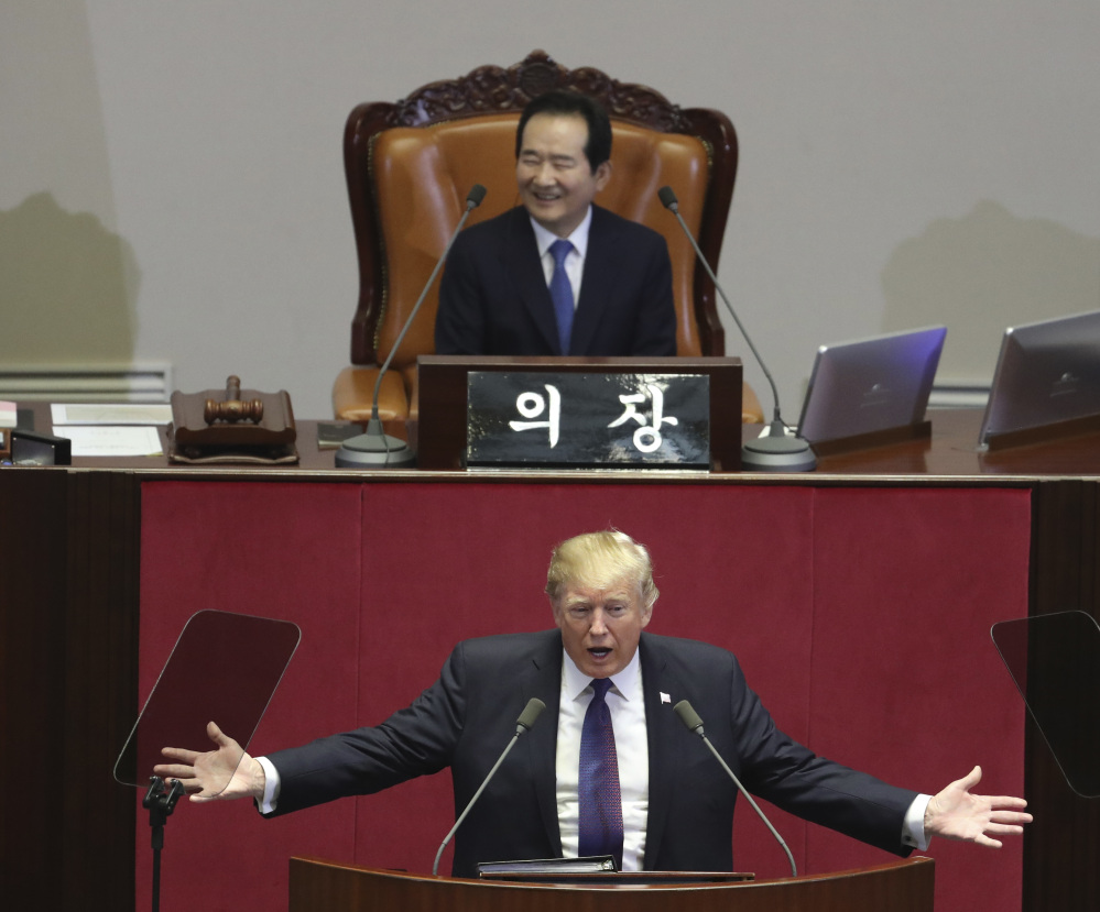 President Trump delivers a speech as South Korea's National Assembly Speaker Chung Sye-kyun, top, listens at the National Assembly in Seoul, South Korea, Wednesday. Trump told the Assembly that he wants "peace through strength."  He said that the U.S. is rebuilding its military and spending heavily on the newest and finest military equipment.
Associated Press Lee Jin-man, Pool