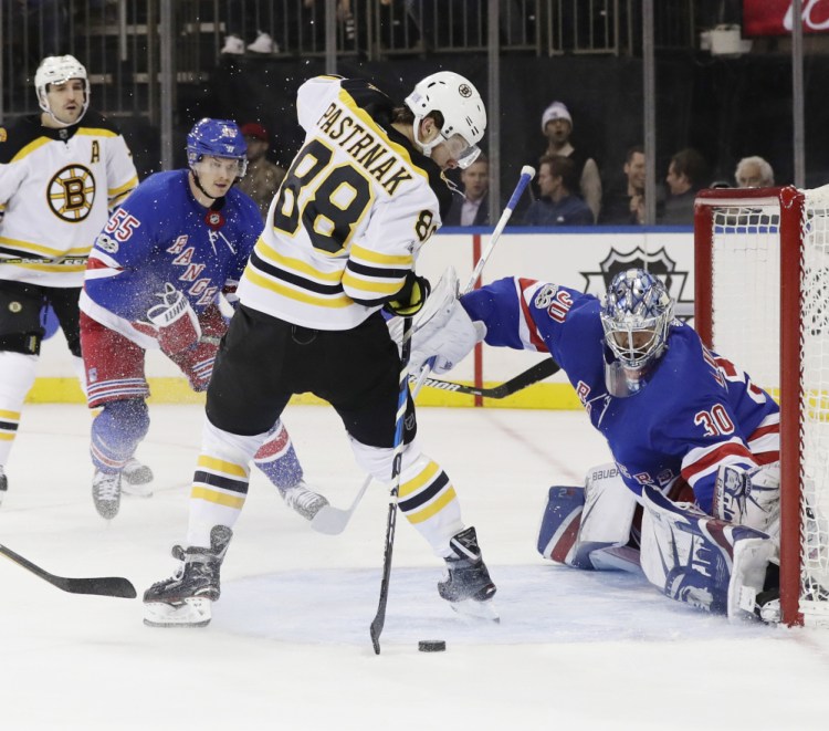 Boston's David Pastrnak shoots the puck past Rangers goalie Henrik Lundqvist in the first period Wednesday night in New York.