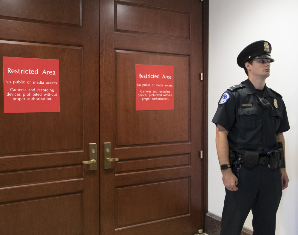 A U.S. Capitol Police officer stands guard outside a secure area in the basement of the Capitol, where the House Intelligence Committee has been conducting interviews. The panel is preparing to interview Russian-American lobbyist Rinat Akhmetshin.
