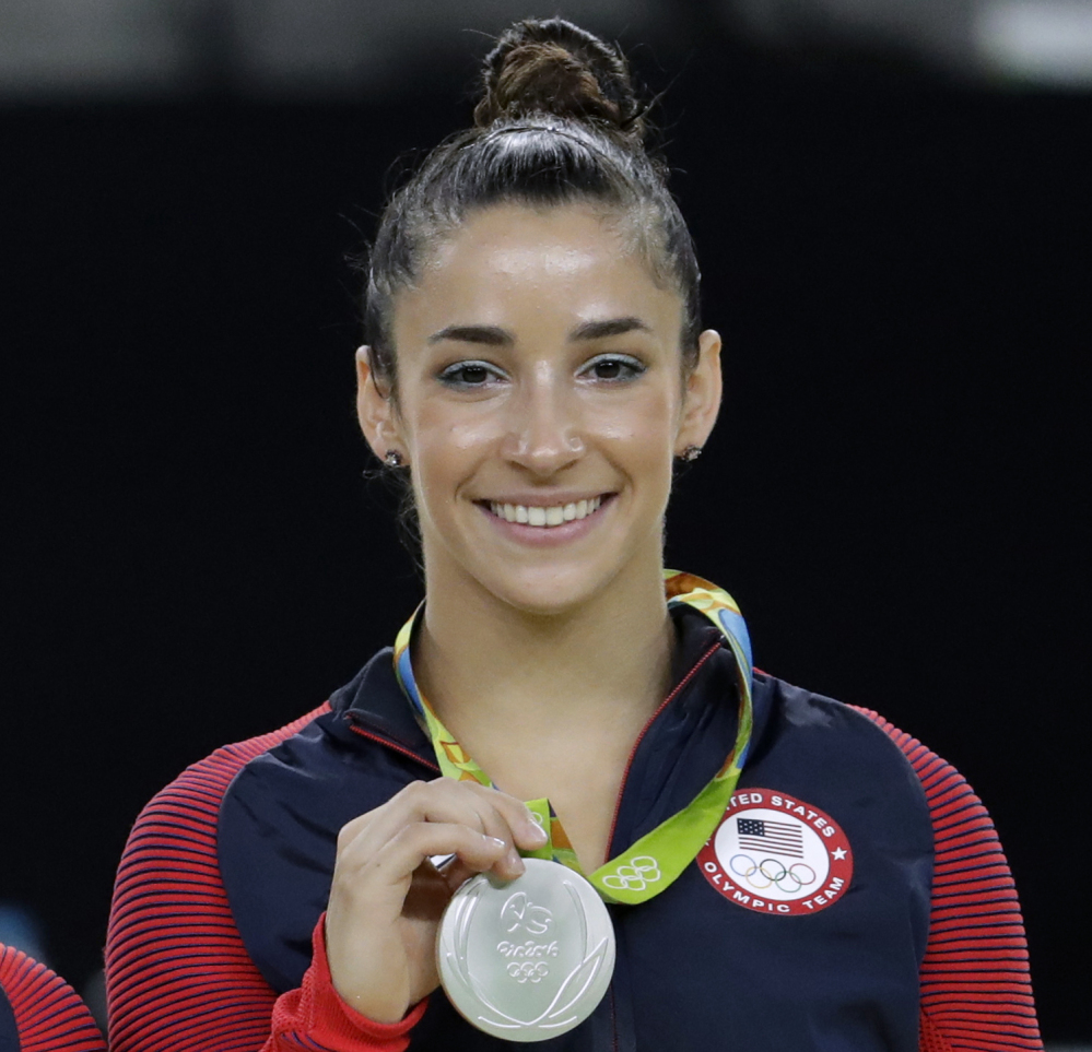 Aly Raisman shows off her silver medal after the artistic gymnastics women's apparatus final at the 2016 Summer Olympics in Rio de Janeiro, Brazil. 