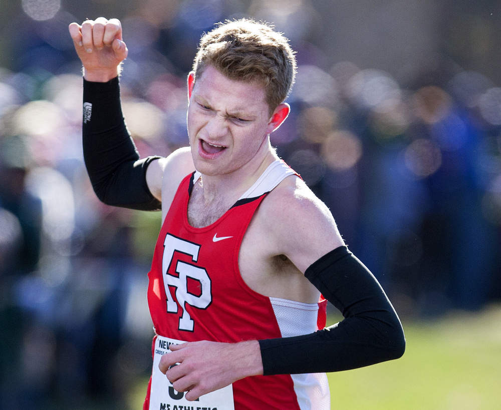 Drew Thompson of Connecticut's Fairfield Prep celebrates as he crosses the finish to win the boys' race by more than 30 seconds.