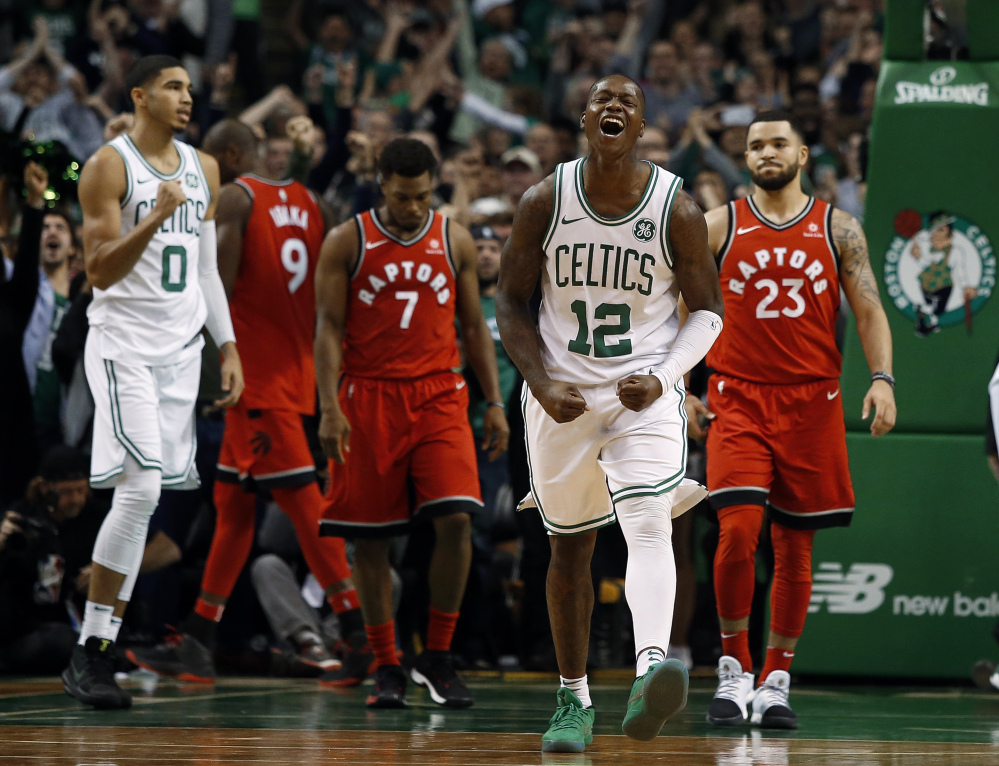 Celtics guard Terry Rozier celebrates after Boston extended its winning streak to 12 games with a 95-94 win Sunday afternoon against the Toronto Raptors.