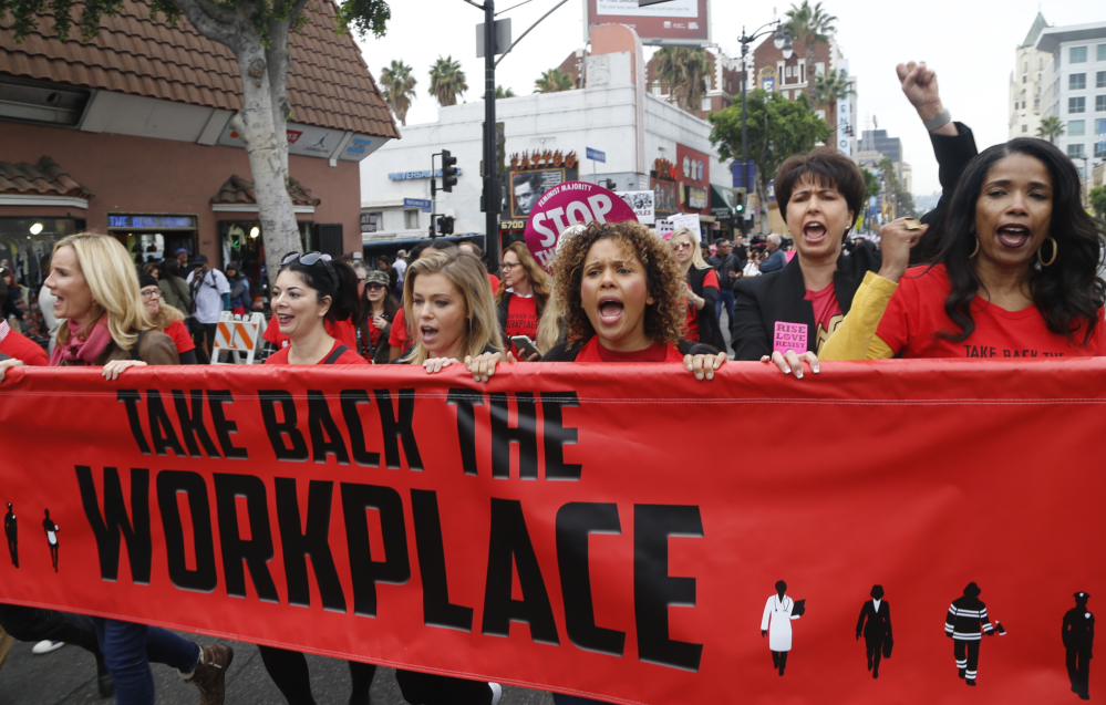 Participants march against sexual assault and harassment at the #MeToo march in Los Angeles on Sunday.