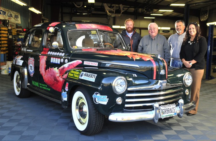 From left, Patrick Wright, Peter Prescott, Ed Chapman and Katie Doherty stand with Prescott's 1948 Ford in Gardiner. Prescott has been a fan of the Great Race for more than 20 years. Staff photo by Joe Phelan