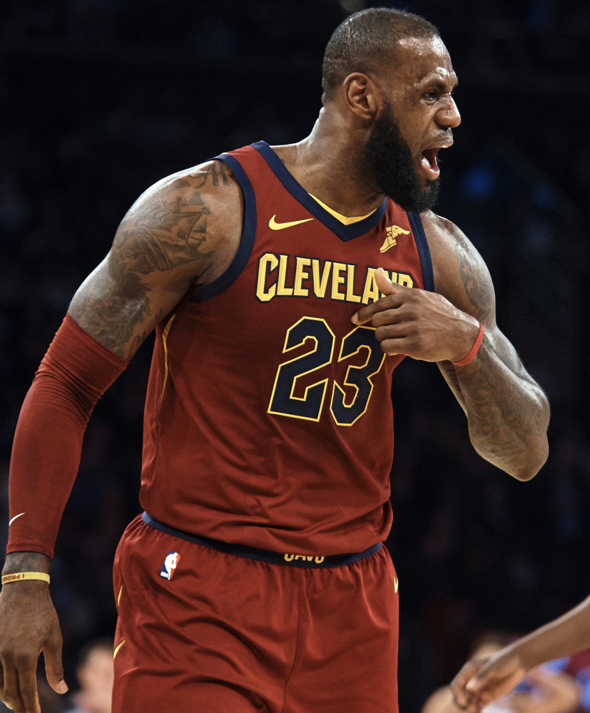 Cleveland's LeBron James complains to the referee in the first half of the Cavaliers' 104-101 win over the Knicks on Monday in New York. James had 23 points and 12 assists.