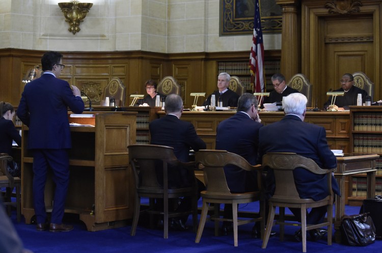 The Connecticut Supreme Court listens to attorney Josh Koskoff as he presents arguments on whether gun maker Remington Arms should be held liable for the 2012 Newtown school massacre, in Hartford, Conn., on Tuesday.