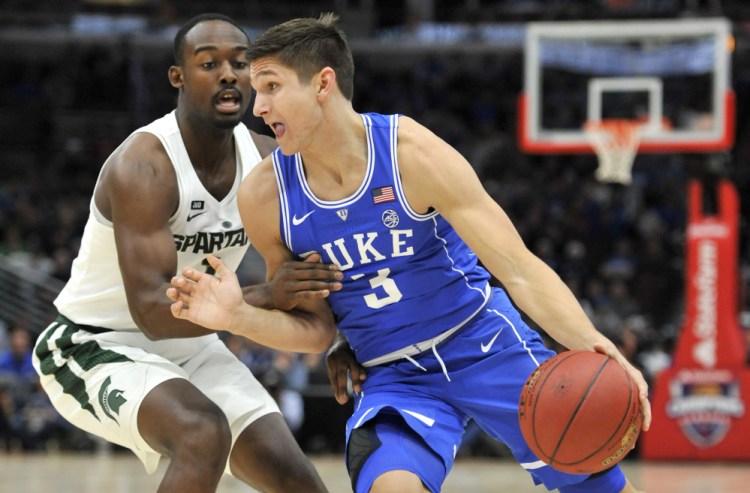 Grayson Allen of Duke, who scored 37 points, drives on Joshua Langford of Michigan State during the first half of Duke's 88-81 victory Tuesday night in an early-season game at Chicago between the nation's top-ranked teams.