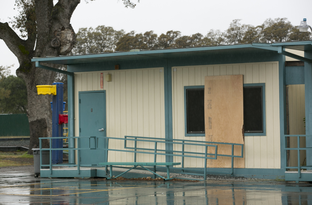 Plywood covers a window at the Rancho Tehama Elementary School on Wednesday, a day after Kevin Janson Neal's shooting rampage at Rancho Tehama Reserve, Calif.