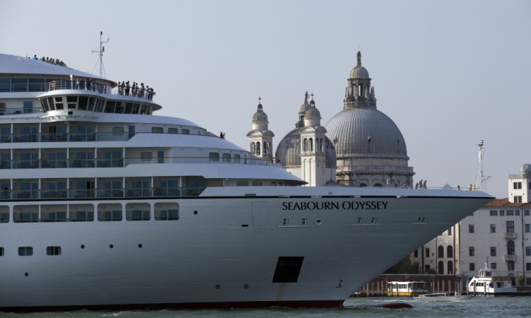 A cruise ship transits the Giudecca canal in front of St. Mark's Square in Venice, Italy, in this 2014 photo.